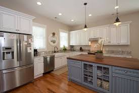 Country Kitchen With White Cabinets Walnut Countertop Painted Blue Island And Farmhou Farmhouse Kitchen Design Country White Kitchen Modern Farmhouse Kitchens