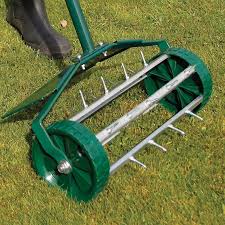 The aerating garden tool is made from durable steel and features a rotating spiked cylinder attached to a steel pole. Pin On Haven Garden
