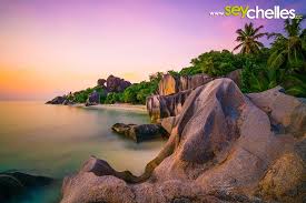 Powdery white sand is offset by towering granite boulders worn smooth by the passage of time. Sunset On Anse Source D Argent On La Digue Seychelles Seychelles Ladigue Longexposure Natural Landmarks Landmarks Sunset