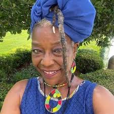 Who would handle adding a description to the Tuggle mural in Birmingham?