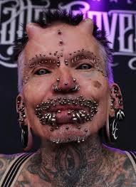 (science daily) 2018 study results may shake the existing hospital policy on tattoos and piercings. World S Most Pierced Man With 450 Studs Shows Off His Devil Horns At Tattoo Convention