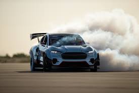 Witness Ken Block Shred Tires In The Ford Mustang Mach E 1400 Deep underground at ford's product development center, a large studio has been converted into an immersion room, its temporary walls papered with endless powerpoint slides. witness ken block shred tires in the ford mustang mach e 1400
