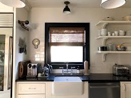 14 Ways To Make Your Kitchen Look And Feel Bigger Kitchen Design Small Kitchen Remodel Small Kitchen Remodeling Projects