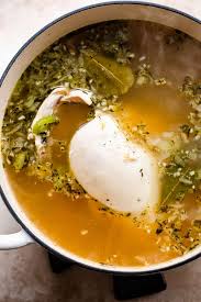 A food handler has finished trimming raw chicken on a cutting board and needs it to prep vegetables. The Best Chicken Noodle Soup Recipe Healthy Homemade Winter Soup