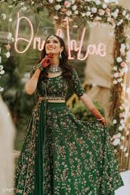 This whimsical emerald green wedding scene planned by lux event rental drew its inspiration doused in rich shades of green and gold, the setup includes white resin chairs, gold satin linens, and. Emerald Green Outfits Are The New Pick For Wedding Festivities