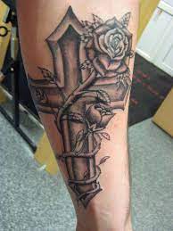 The forearm area of the body also provides a large canvas for the tattoo, if you don't want big and detailed flower tattoo then you can choose miniature flower design. Cross An Roses Tattoo Rose Tattoos For Men Classy Tattoos For Women Rose Tattoos