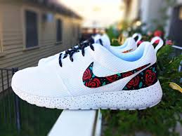 Dressed in a hawaiian floral print done in a variety of colors that overlays a black mesh upper. Custom Nike Roshe Run Rose Design Floral Custom Roshe Rose Gold Design Red Roses With Teal Leaves And Gold Speckles Custom Roshe Run Roses