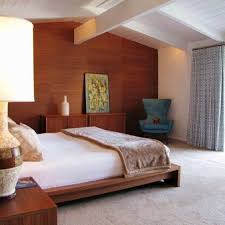 A minimalist bathroom with an orange accent wall, a shower space clad with black tiles is a very chic and cool space. 24 Mid Century Modern Bedroom Decorating Ideas