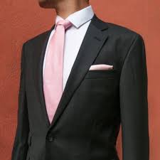 Look Effortlessly Stylish With A Dark Suit And Matching Pink Accessories Groomsmen Attire Pink Pink Prom Suit Black Prom Tux