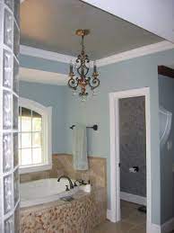 And lastly, why not just forgo most of the wall space altogether and instead paint your ceiling (and perhaps a few inches of upper wall space too) a. Tan Cream Tile Blue Walls And White Tub Hmmm A Bit Too Much But Good Colors Together For Relaxing Bath Bathroom Colors Colored Ceiling Home