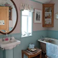 Pipe clamps and a towel rack are installed onto an old window to create this gorgeous and functional bathroom piece. Creative Interior Decorating In Vintage Style Bringing Bold Colors Into Room Decor Vintage Bathroom Decor Vintage Bathrooms Antique Bathroom Ideas