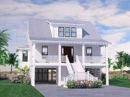 The foundations for these home designs typically utilize pilings, piers, stilts or cmu block walls to raise the home off grade. Seabright Cottage Beach House Floor Plans Stilt House Plans Southern House Plans