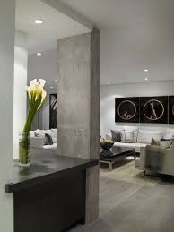 Contemporary trends in interior design are pushing to celebrate the ordinary, rather than the ornate. Modern White Entry With Decorative Concrete Beam Luxe Interiors Design