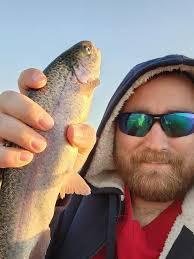 Ice fishing tournament scene described