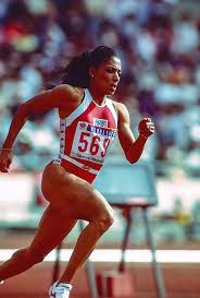 At the 1988 seoul olympics she won three gold medals in the 100, 200 and 4x100 meters. Florence Griffith Joyner Competing In 1988 Photograph By Pcn Photography