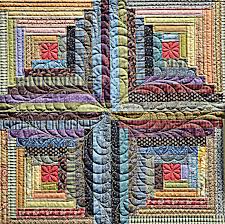 It adds a bit of movement and more importantly for me, it is a continuous pattern, avoiding stop start quilting. Nice Center Medallion Quilting And Continuous Lines Throughout Logs Sisters Quilt Show 201 Free Motion Quilt Designs Log Cabin Quilts Machine Quilting Designs