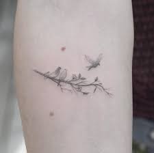 3 Birds Sitting On A Tree Branch Tattoo Three Little Birds Thanks For Letting Me Do This Bob Marley Piece For You Lauren Small Bird Tattoos Little Bird Tattoos Foot Tattoos