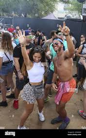 Alejandra Vila, 18, left, and Virgil Sweet, 18, dance at the Arcadia Spider  during the third day of Ultra Music Festival on Sunday, March 26, 2017 in  downtown Miami, Fla. (Photo by