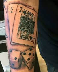 Cards and dice tattoos on inner bicep. 75 Dice Tattoos For Men The Gambler S Paradise Of Life