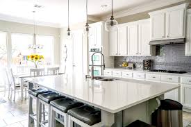 Banks of drawers and a large island provide plenty of storage for a hardworking space. The Pros And Cons Of Inset Cabinets Vs Full Overlay Cabinets Nebs