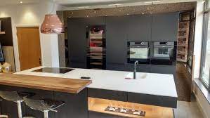 Maybe you would like to learn more about one of these? Rempp Matt Black Kitchen With Island In Black Stone Cream Silestone Worktops De Dietrich Appliances
