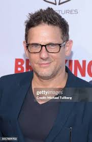 Elisa Rogers and guest attend the world premiere of "Breaking &... News  Photo