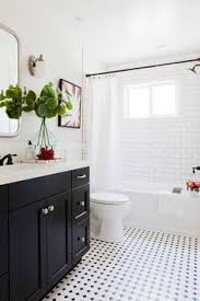 Bathroom design in the 1930s is easily translatable in to design for the 21st century, especially if you own a vintage home. Black And White Bathroom With Subway Tile Shower Interesting Tile Detail Around Window Bathroom Floor Tile Small Bathroom Inspiration Vintage Style Bathroom