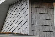 Combining 2 cabinet colors and tile detail on the hood vent. Ganser Company Madison Wi Home Remodeling Contractors
