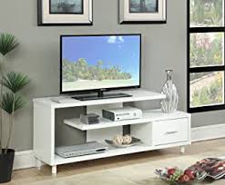 A long low frame of wooden materials is finished in white but front panels are in warm brown tones. Amazon Com Television Stands White Television Stands Entertainment Centers Tv Med Home Kitchen