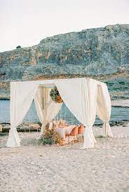 Beach Vow Renewal In Greece With Clouds Of Baby S Breath Ruffled Vow Renewal Beach Gazebo Wedding Vow Renewal