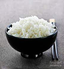 At japanese funerals, a bowl of rice is left with two chopsticks standing vertically in the center. Bowl Of Rice With Chopsticks Photograph By Elena Elisseeva