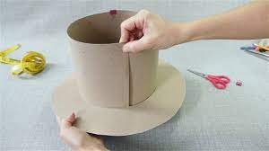 On a thick piece of cardboard measuring 52cm x 52cm (minimum), poke a hole in the middle. How To Make A Top Hat 12 Steps With Pictures Wikihow