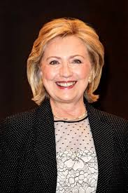 Doting grandmother, among other things. Donald Trump Hillary Clinton Hair Wig