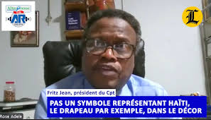 Pas un symbole représentant Haïti, le drapeau par exemple, dans le décor de  l'interview de Fritz Jean avec Listin Diario. Mais, un bocal de pistache.  https://youtu.be/Gjnr5IAtZO4