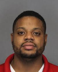 Utica parolee charged with firearm possession