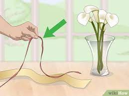 Whether i m decorating a coffee table styling a book shelf or actually using a vase for some fresh blooms i want to take a second to show you how i use vases. 3 Ways To Decorate A Flower Vase With A Ribbon Wikihow