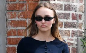 Her look, a gen z take on the brand's iconic items, included hot. Lily Rose Depp Street Style Crop Top Mom Jeans Chanel Heels Footwear News