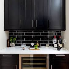 Here, the black quartz tiles create a divine backsplash. Kitchen Backsplash Ideas For White Cabinets Black Countertops Instaimage