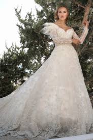 boncuk islemeli otris detayli kuyruklu a kesim gelinlik boncuk islemelerin yarattigi romantik gorunum uzun kol ve ona eslik eden the dress gelinlik geli nli k