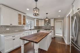 White Cabinets With Granite And Butcher Block Island Mixed Metal Lighting Diy Kitchen Remodel Kitchen Remodel Kitchen Design