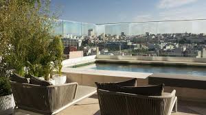 Is garden rooftop by imperium located near the city center? 8 Best Rooftop Pools Lisbon 2021 Update