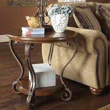Enjoy free shipping & browse our great selection of living room furniture, coffee tables, console & sofa tables and more! Nestor Round End Table Medium Brown Set Of 1 T517 6 By Ashley Furniture Signature Design Bernie Phyl S Furniture By Ashley Furniture