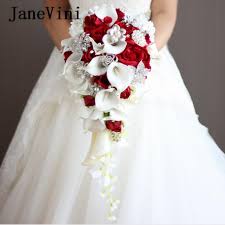 What kind of flowers are in a wedding bouquet? Waterfall Red Wedding Flowers Bridal Bouquets Artificial Pearls