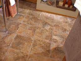 The better choice is laminate flooring. How To Install Snap Together Tile Flooring Bathroom Tile Diy Flooring Tile Floor