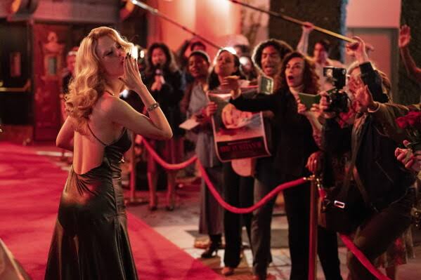 Movie Review: Hollywood, sleazy 80s-style, in 'MaXXXine' | AP News