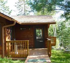 Beautiful white birch and tall pine trees, as well as manicured areas surround this spectacular vacation home cabin. Ely Mn Cabin Rentals The Point River Point Resort