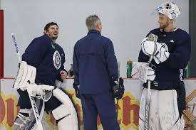 He was born in 1960s, in family: Hellebuyck Back Where He Left Off Winnipeg Free Press