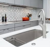 Expansive Island with Glassos Counters and Gorgeous Faucet ...
