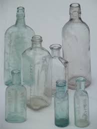 Buy small clear vintage glass bottles with corks, bud vases, decorative, potion, assorted design set of 12 pcs, 4.6 inch tall (11.43cm), 1.4 inch wide (3.56cm): Old Glass Medicine Bottle Lot Clear Aqua Glass Antique Vintage Bottles