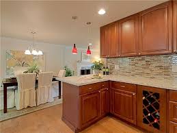 Stained In A Rich Dark Cognac Stain Our Traditional Raised Arch Parawood Cabinets Are Budget Friendly Whi Brown Kitchen Cabinets Kitchen Style Kitchen Remodel